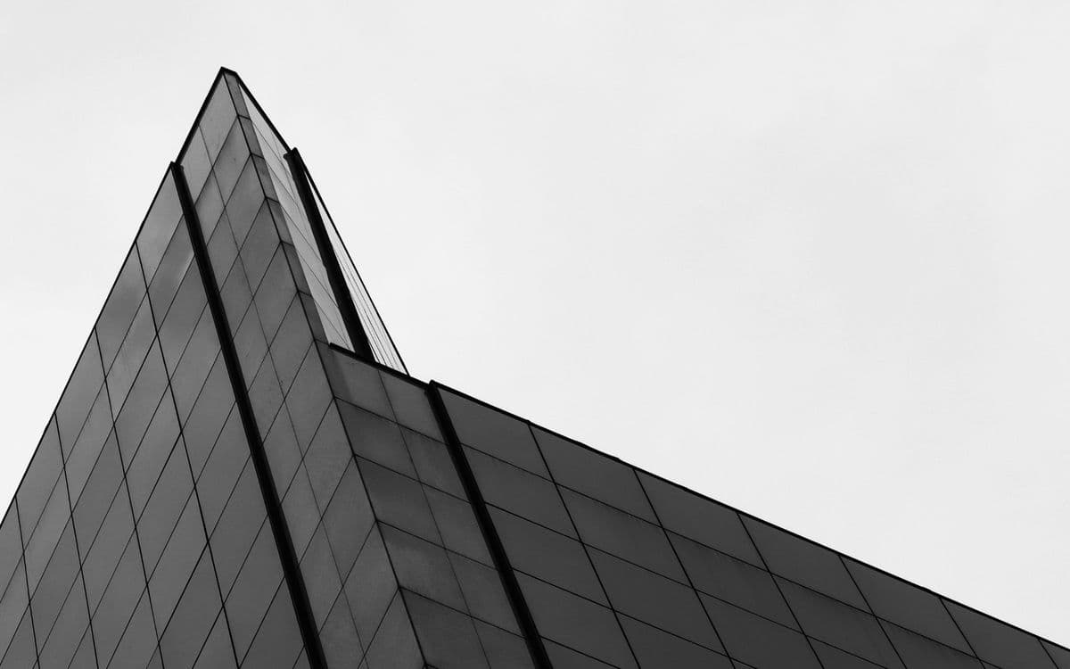 The sharp peak of a glass building