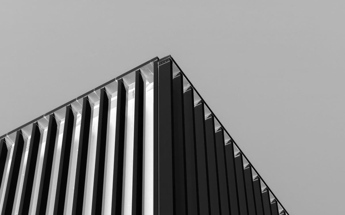 A ribbed tower edge rising into a pale sky