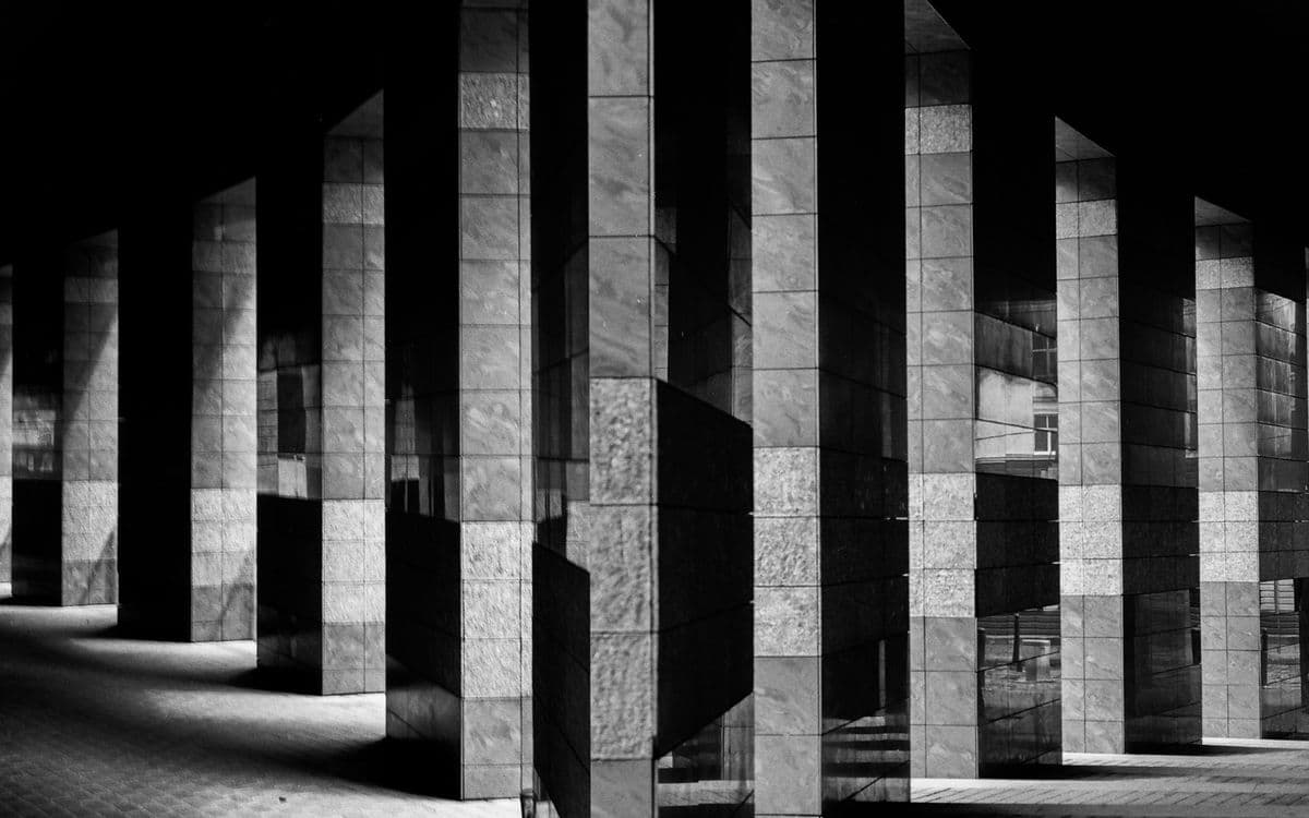 Stone columns casting long shadows