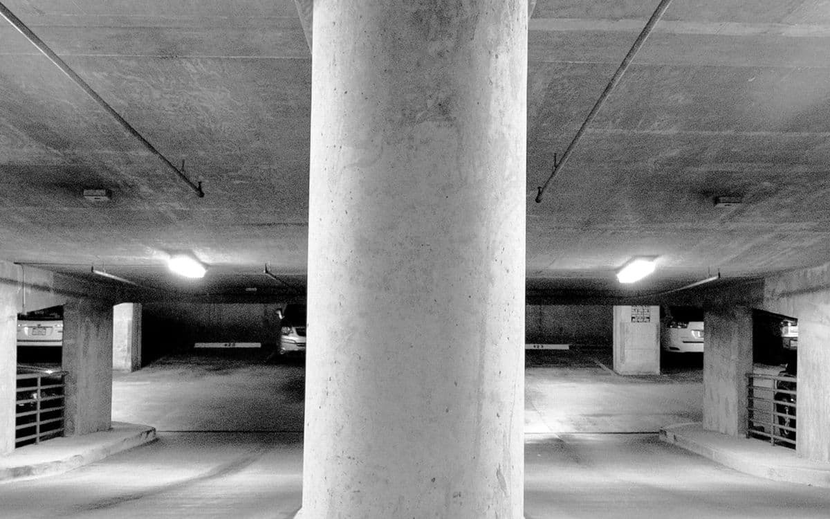 A concrete column in an empty car park