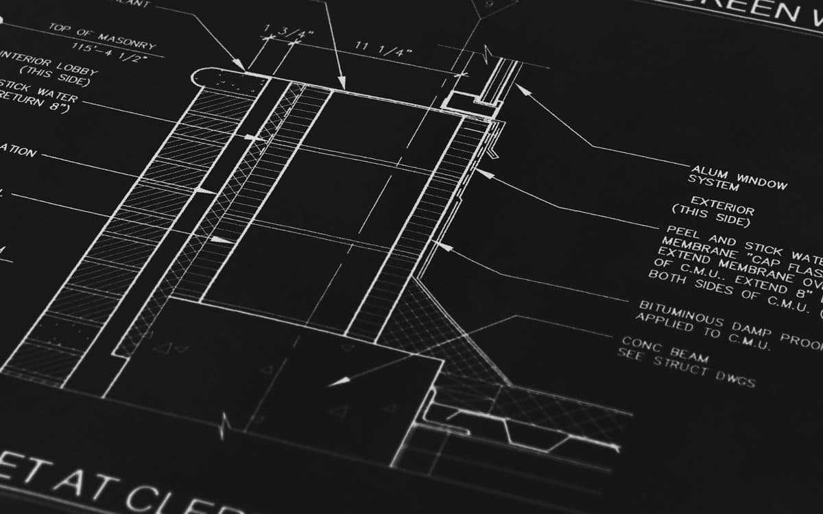 Architectural drawing lines on a dark ground
