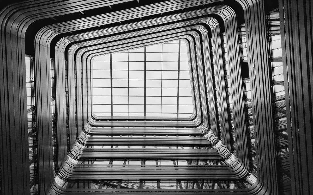 Looking up through a square atrium to a skylight