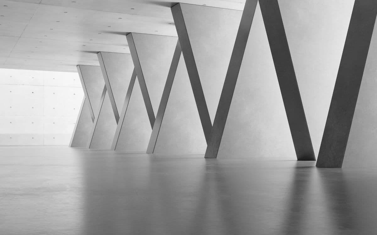 Angled columns in a bright, empty hall