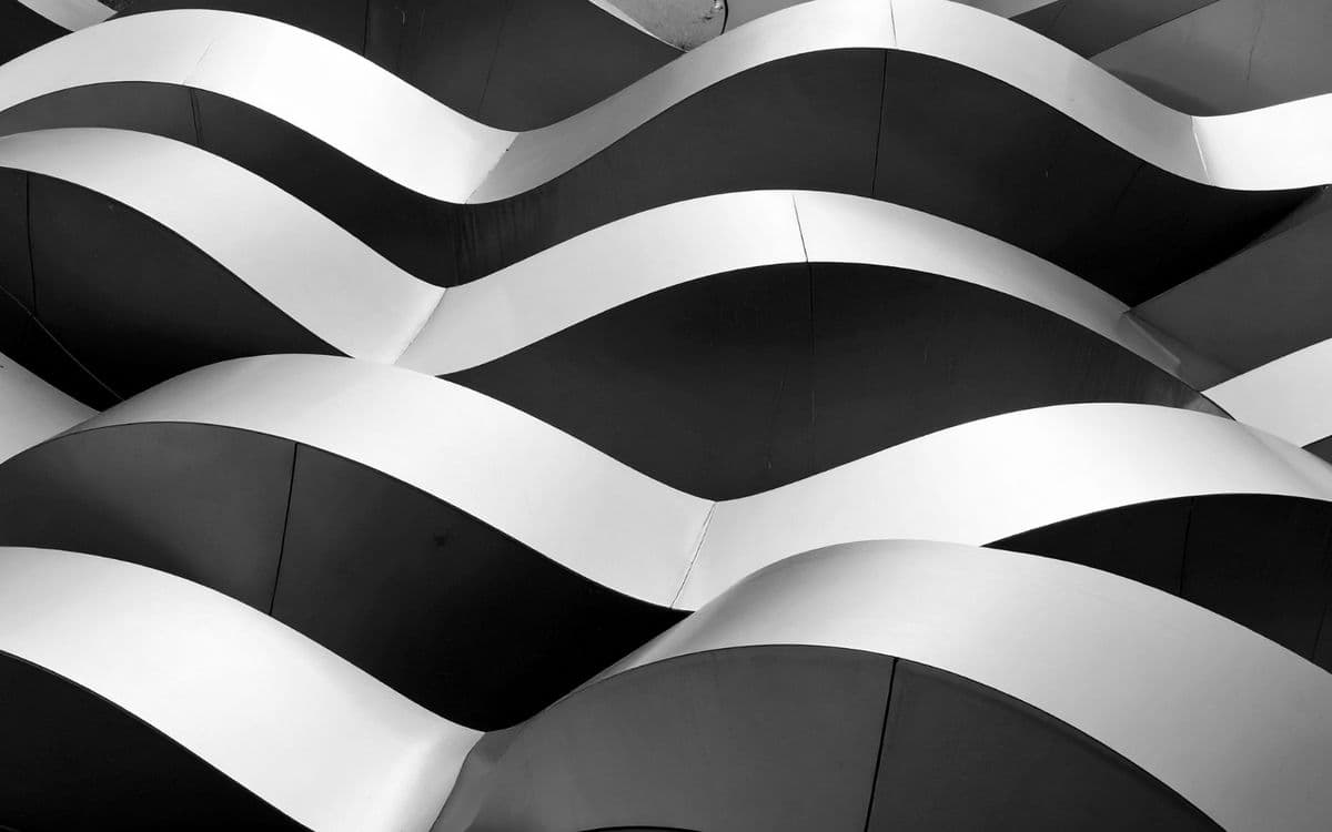 Wave-shaped balconies stacked in black and white